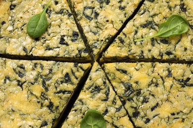 Photo of Closeup view of cut delicious spinach pie