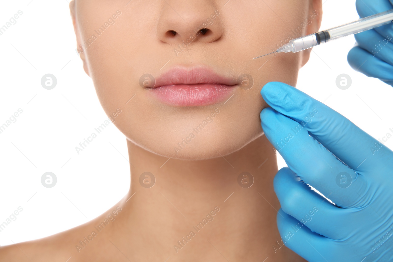 Photo of Young woman getting facial injection on white background, closeup. Cosmetic surgery concept