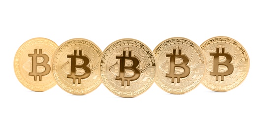 Photo of Gold bitcoins isolated on white. Digital currency