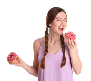 Beautiful young woman with donuts on white background