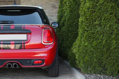 Photo of Lviv, Ukraine - May 10, 2022: Red Mini Cooper S parked outdoors