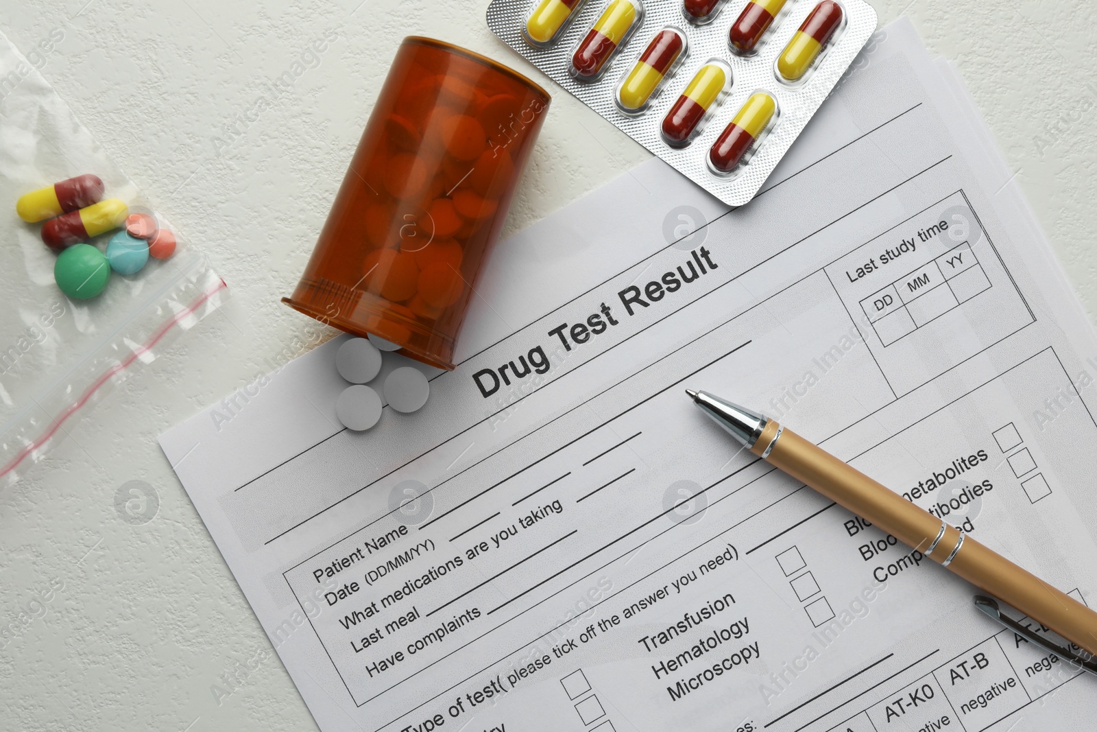 Photo of Drug test result form, pills and pen on light table, flat lay