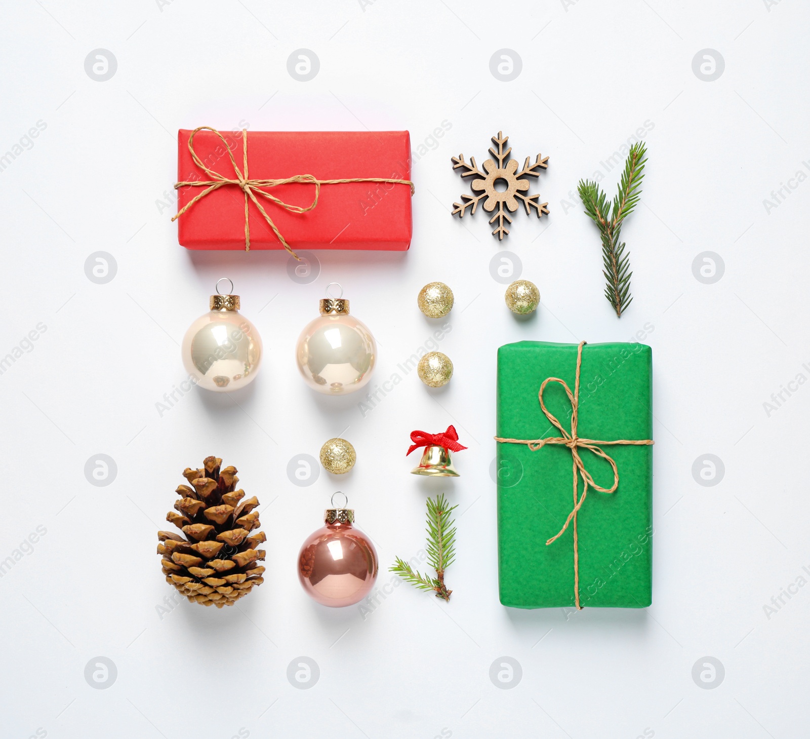 Photo of Flat lay composition with Christmas gifts and festive decor on white background