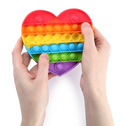 Photo of Woman using pop it fidget toy on white background, closeup