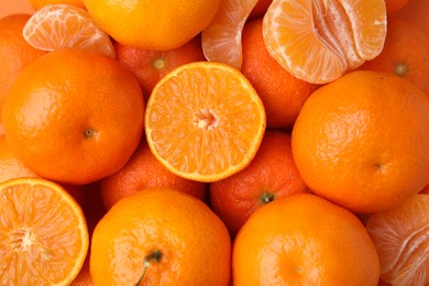 Photo of Heap of fresh juicy tangerines as background, top view