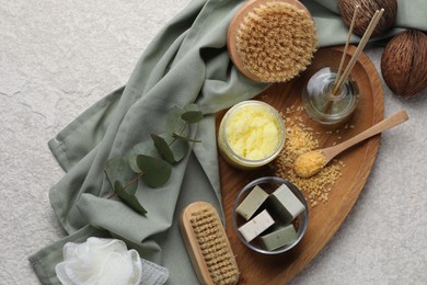 Photo of Composition with different spa products and reed air freshener on light grey textured table, top view
