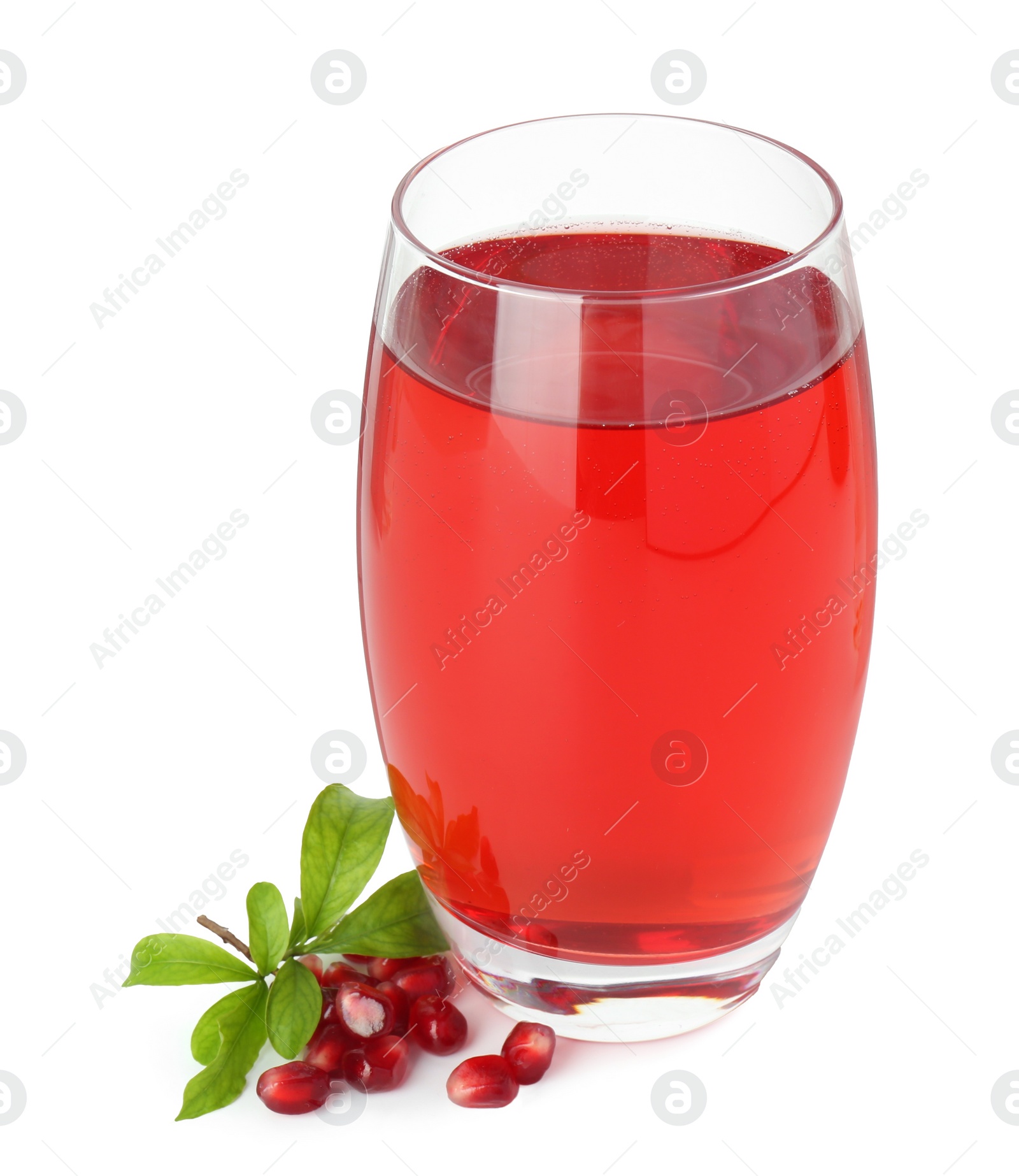 Photo of Refreshing pomegranate juice in glass, leaves and seeds isolated on white