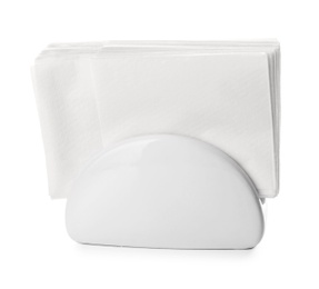 Photo of Ceramic napkin holder with paper serviettes on white background