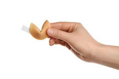 Photo of Woman holding traditional fortune cookie with prediction on white background, closeup
