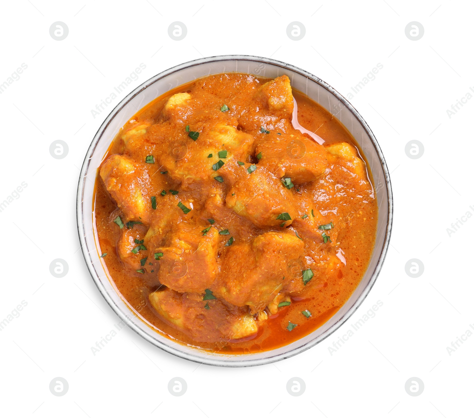 Photo of Bowl of delicious chicken curry on white background, top view