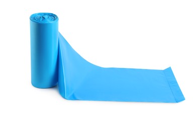 Photo of Roll of turquoise garbage bags on white background. Cleaning supplies