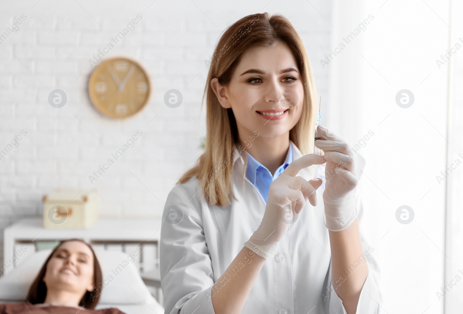 Photo of Doctor vaccinating female patient in clinic