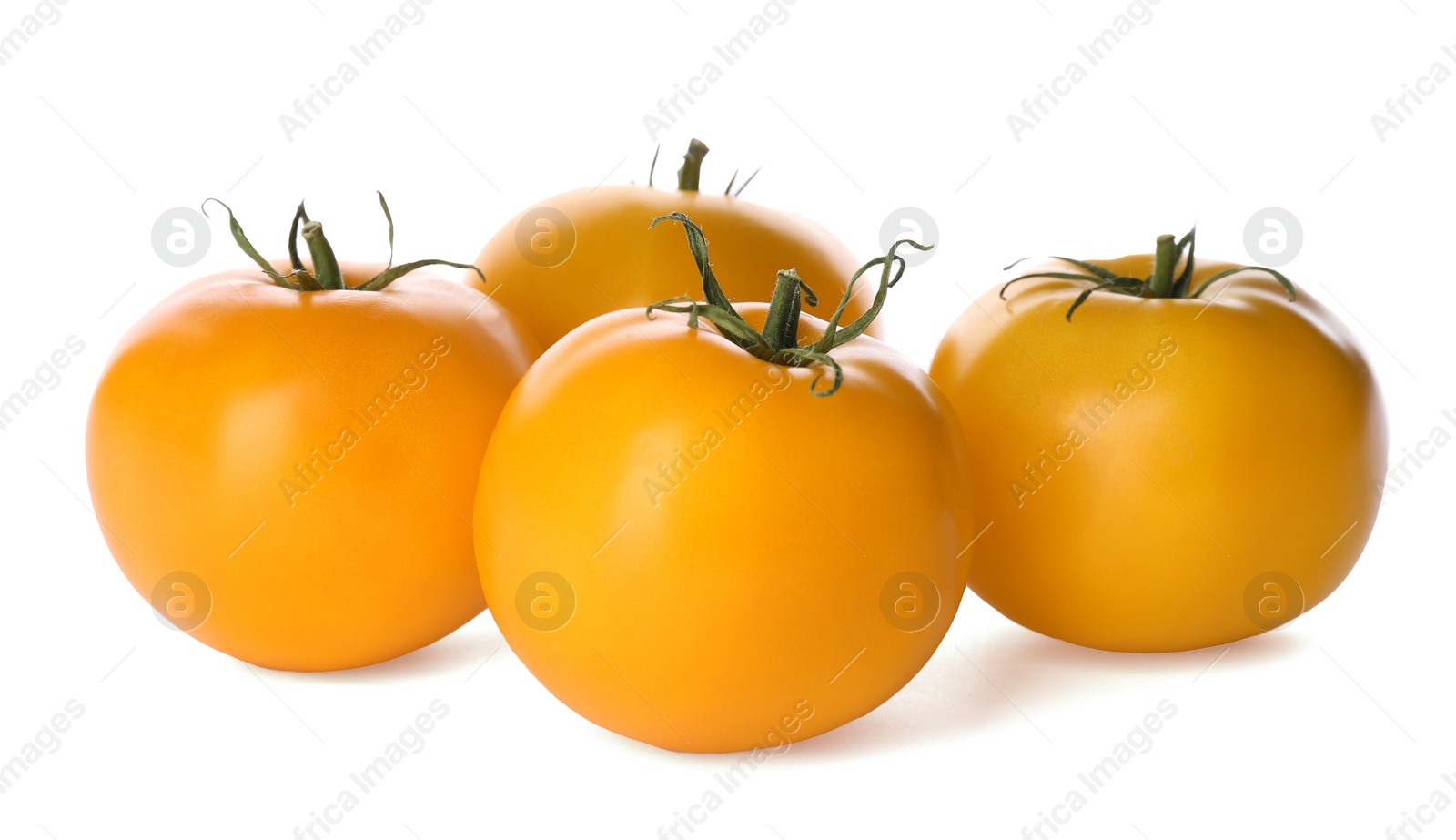 Photo of Delicious ripe yellow tomatoes isolated on white