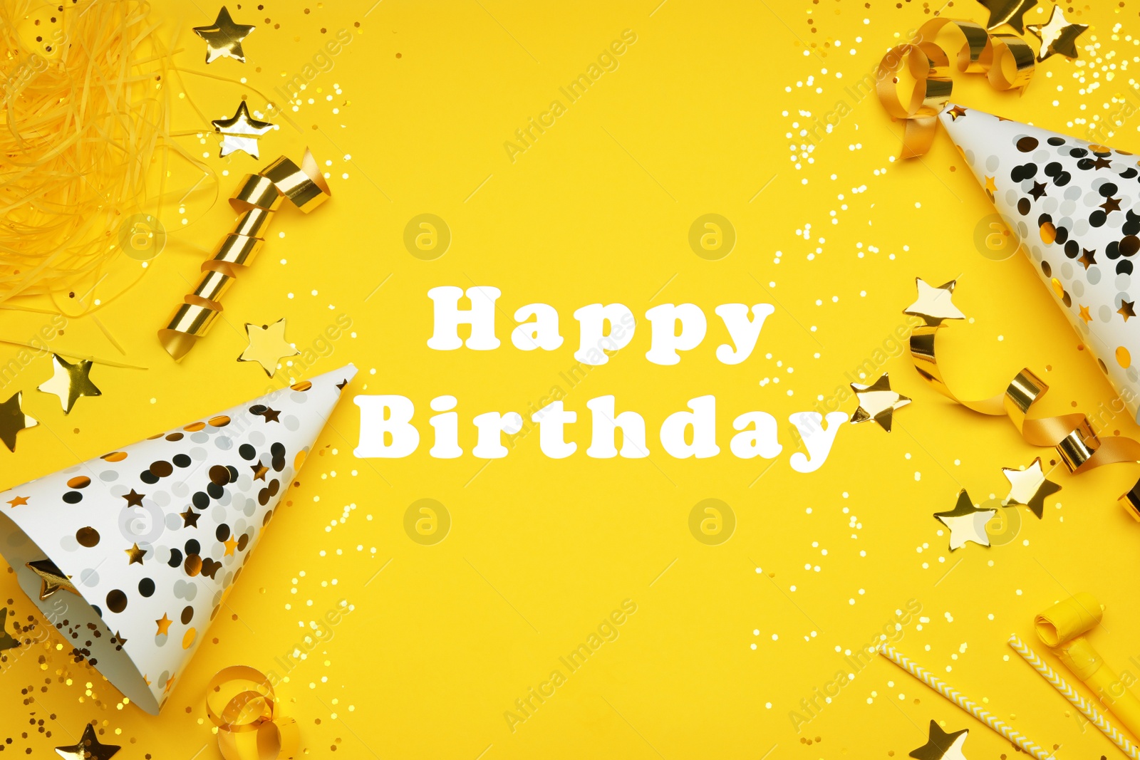 Photo of Flat lay composition with party decor and text Happy Birthday on yellow background