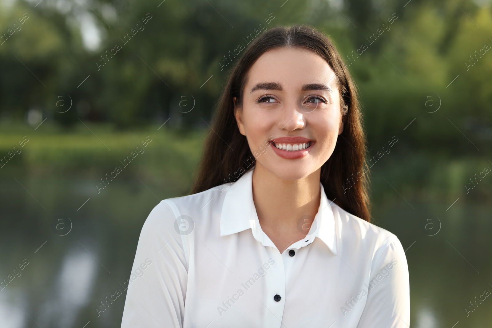 Photo of Portrait of beautiful woman posing outdoors. Attractive lady smiling and posing camera. Space for text