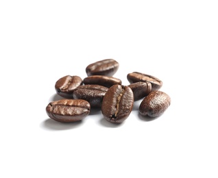 Pile of roasted coffee beans on white background