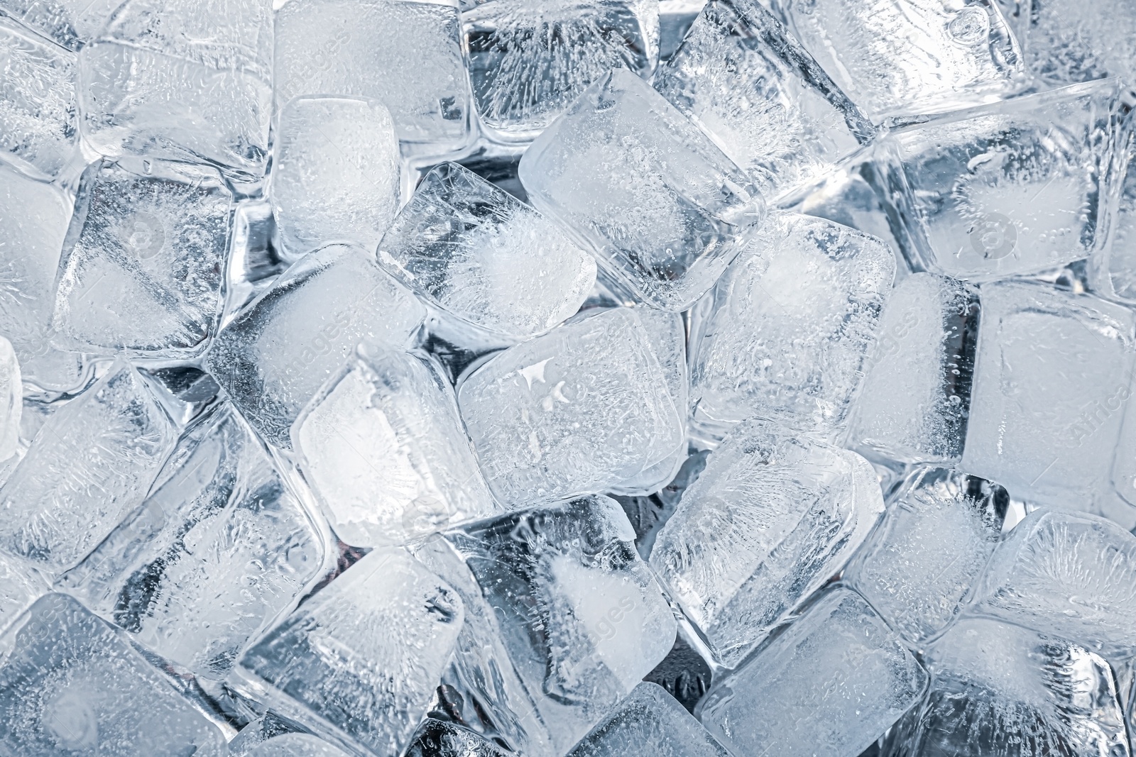 Photo of Crystal clear ice cubes as background, top view