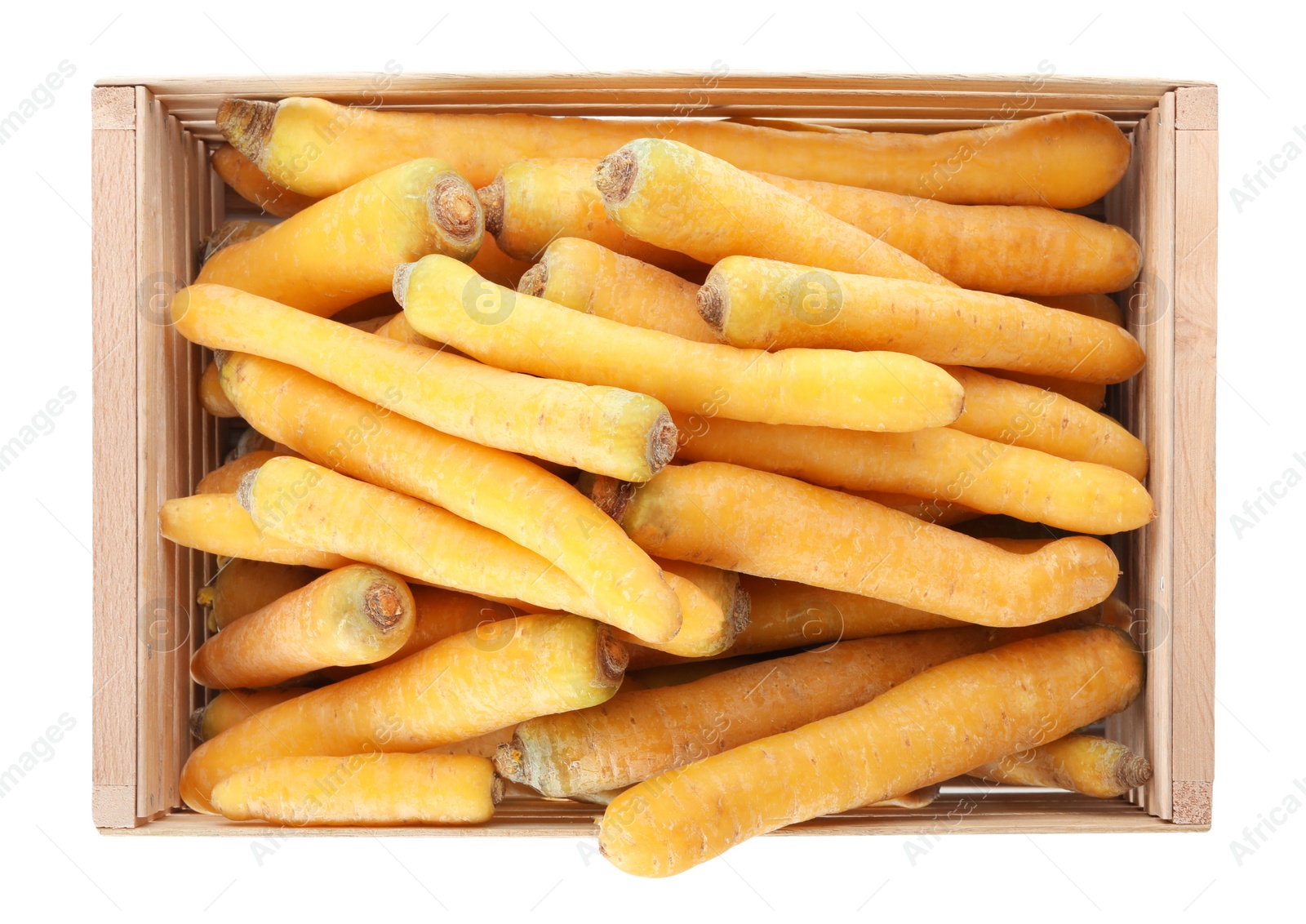 Photo of Raw yellow carrots in wooden crate isolated on white, top view