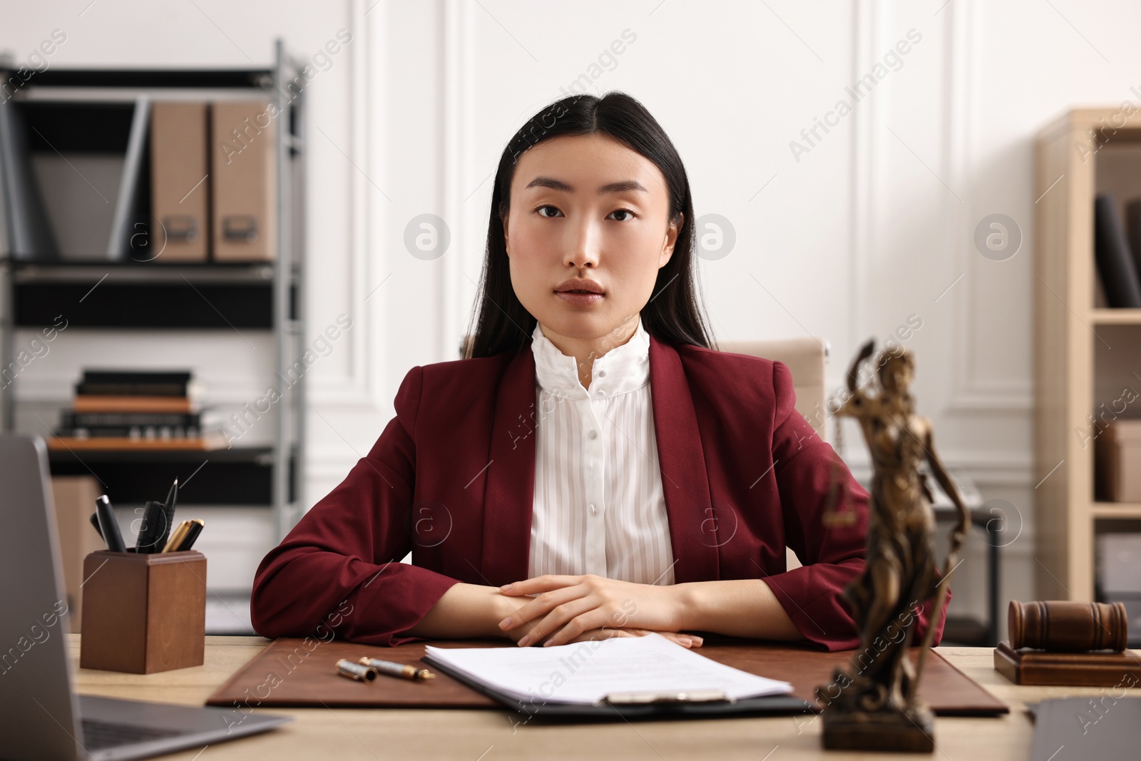 Photo of Portrait of notary at table in office