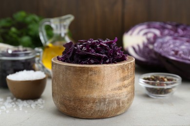 Photo of Tasty red cabbage sauerkraut and different ingredients on table