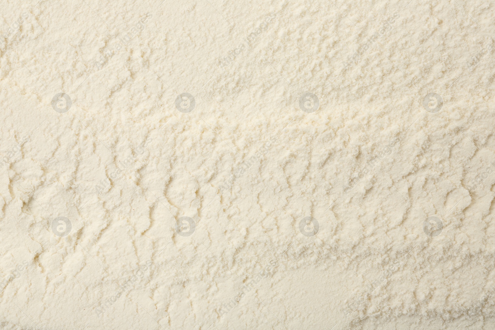 Photo of Texture of baking powder as background, top view