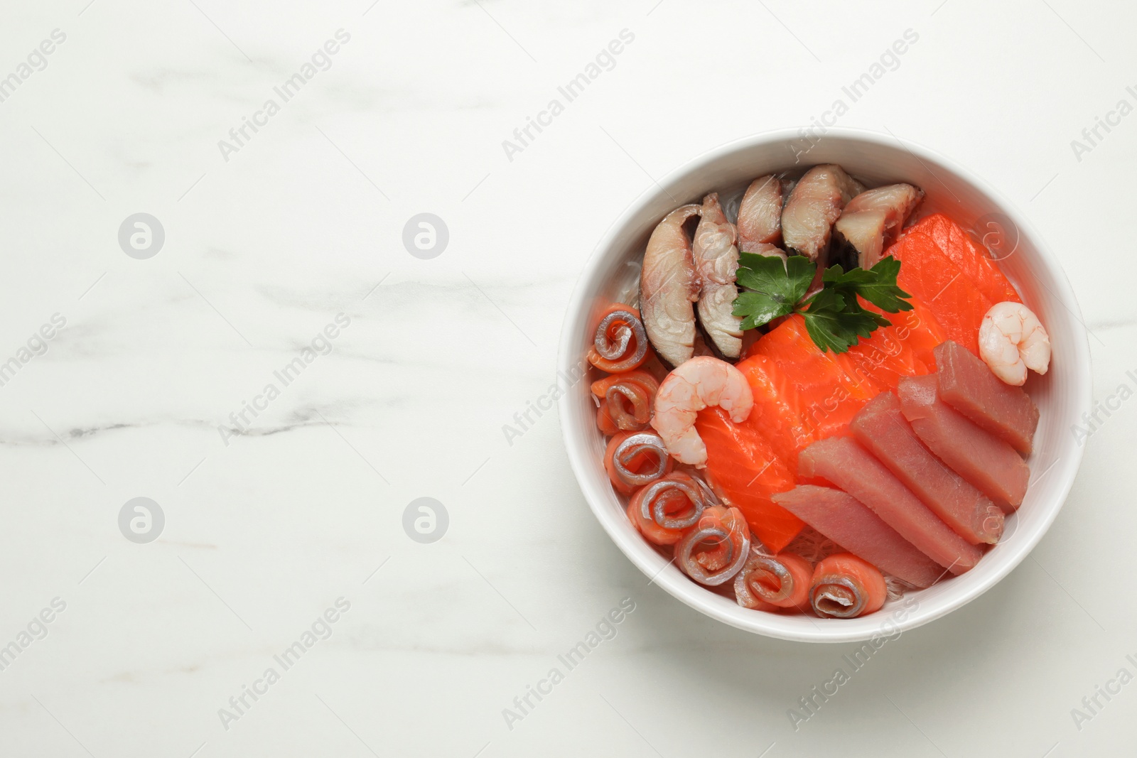 Photo of Delicious mackerel, shrimps, salmon and tuna served with parsley on white marble table, top view with space for text. Tasty sashimi dish