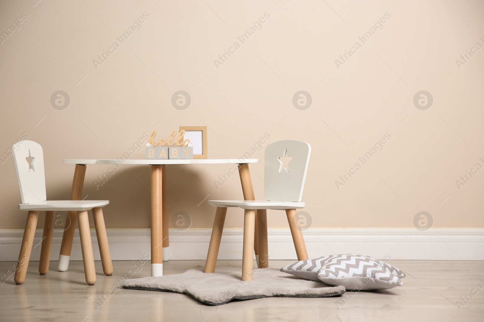 Photo of Baby room interior with stylish table and chairs