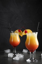 Photo of Just made appetizing cocktails Sex on the Beach, black background