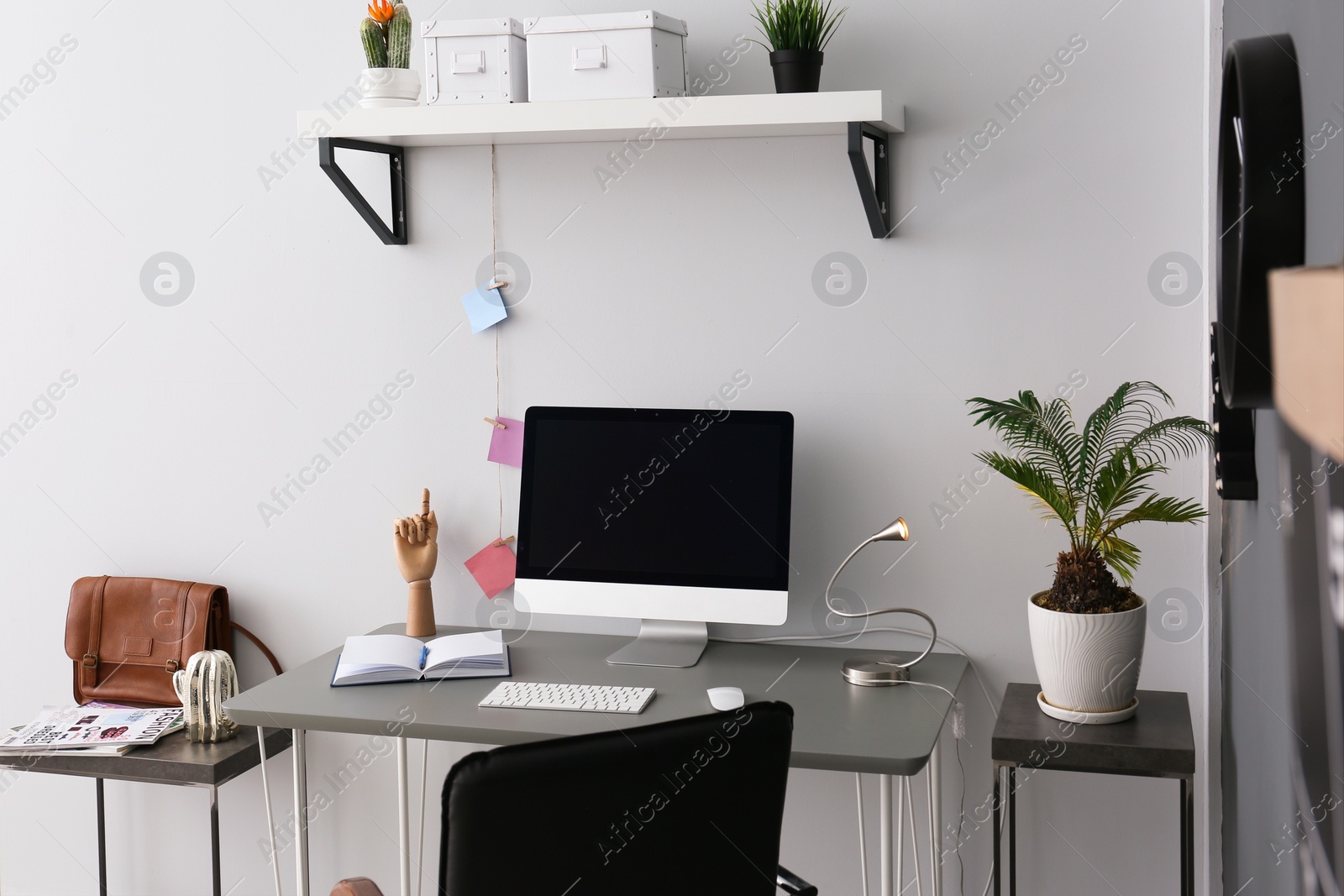 Photo of Comfortable workplace with computer on desk in home office