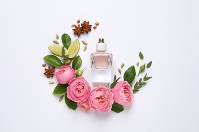 Photo of Flat lay composition with bottle of perfume, lime and beautiful flowers on white background