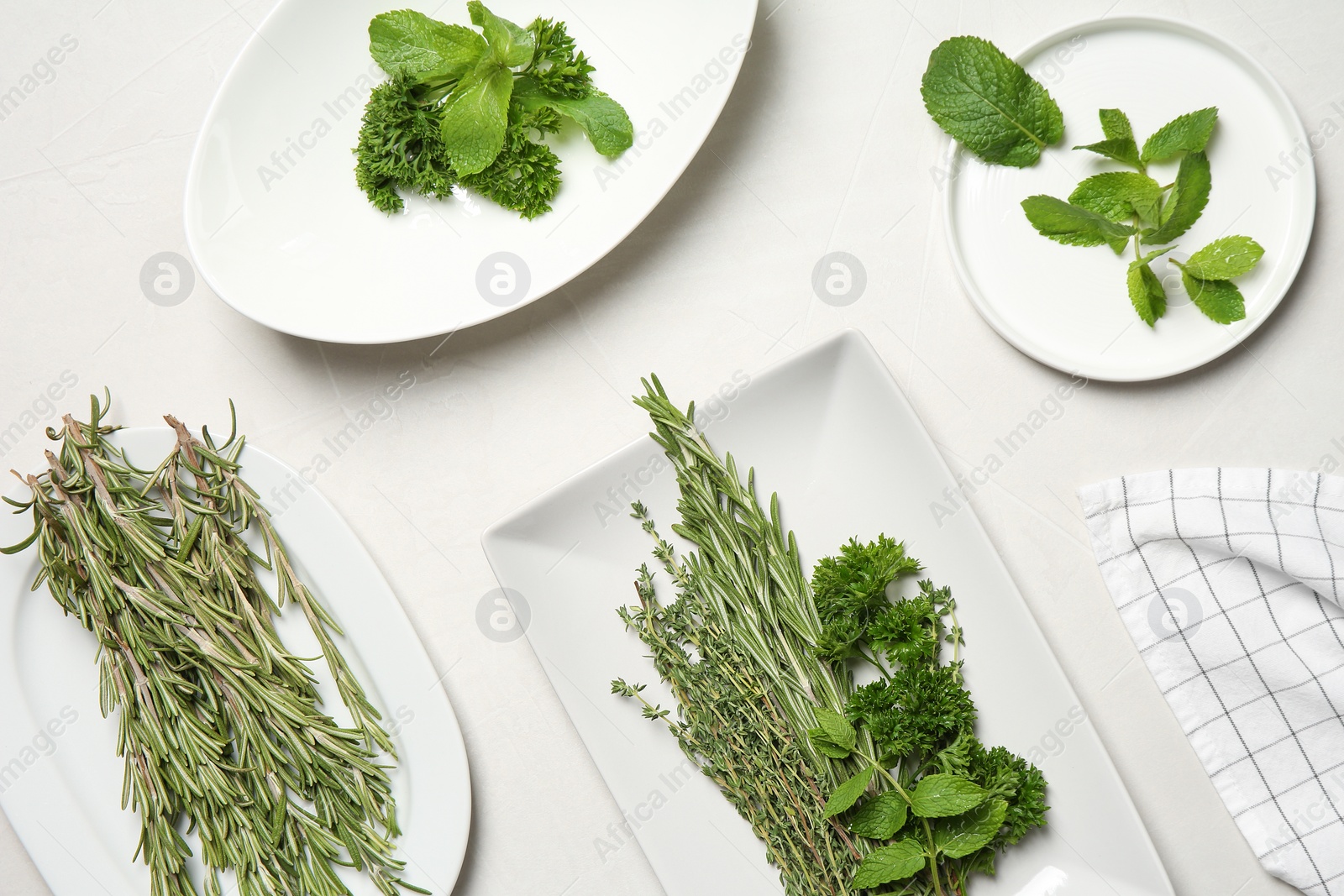 Photo of Flat lay composition with rosemary on light background. Aromatic herbs