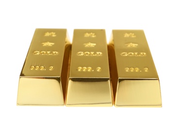 Photo of Precious shiny gold bars on white background