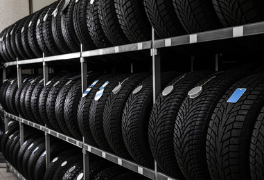 Photo of Car tires on rack in auto store