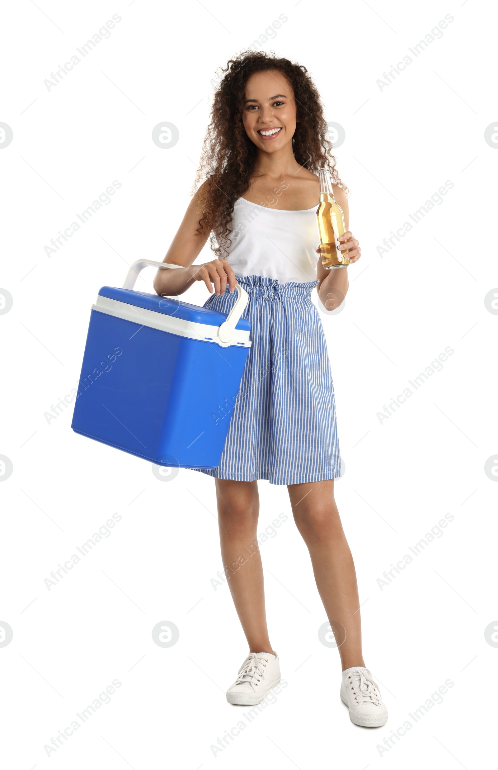 Photo of Happy young African American woman with cool box and bottle of beer on white background