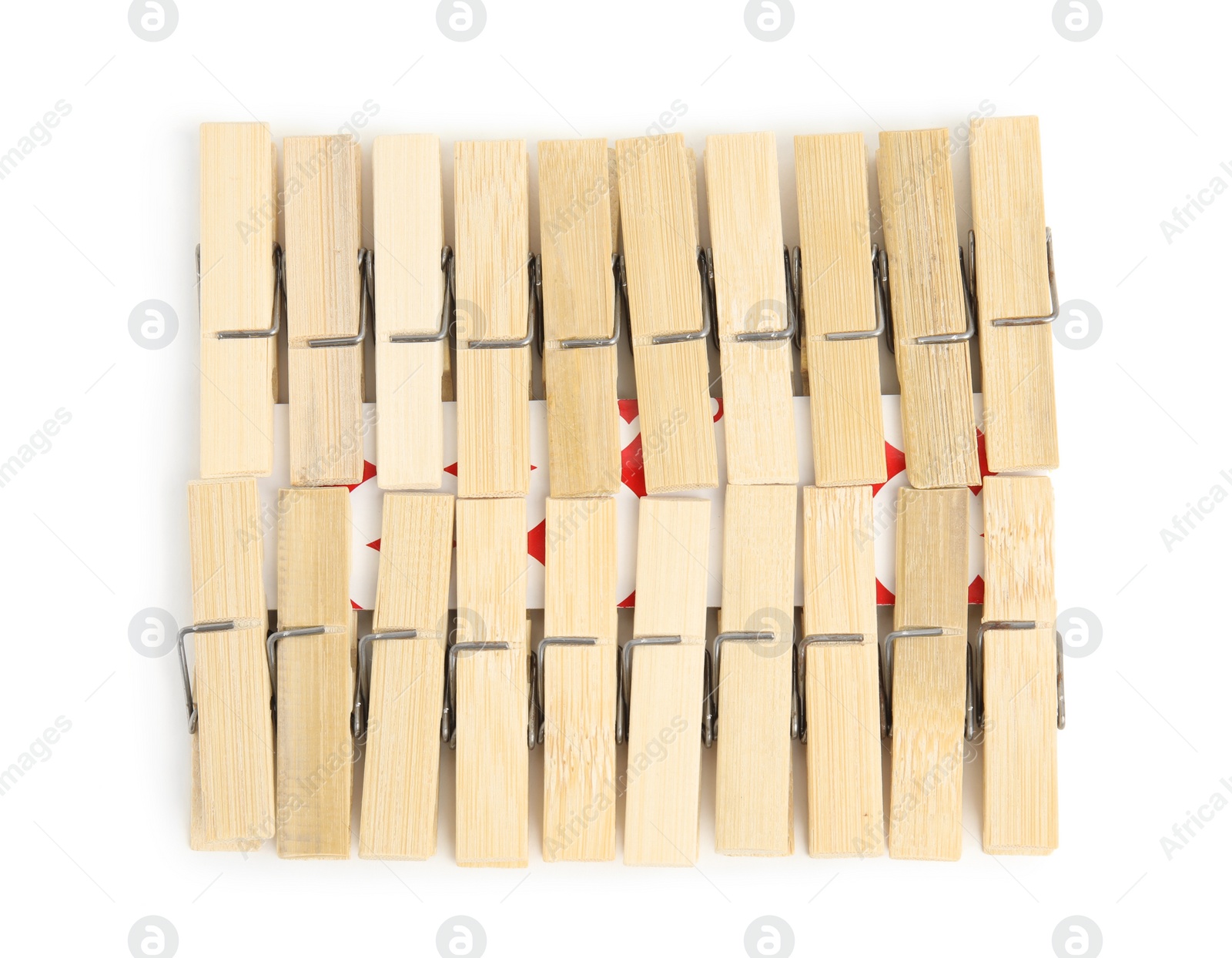 Photo of Set of wooden clothespins on white background, top view