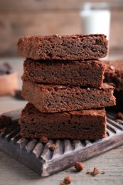 Delicious chocolate brownies on wooden table, closeup