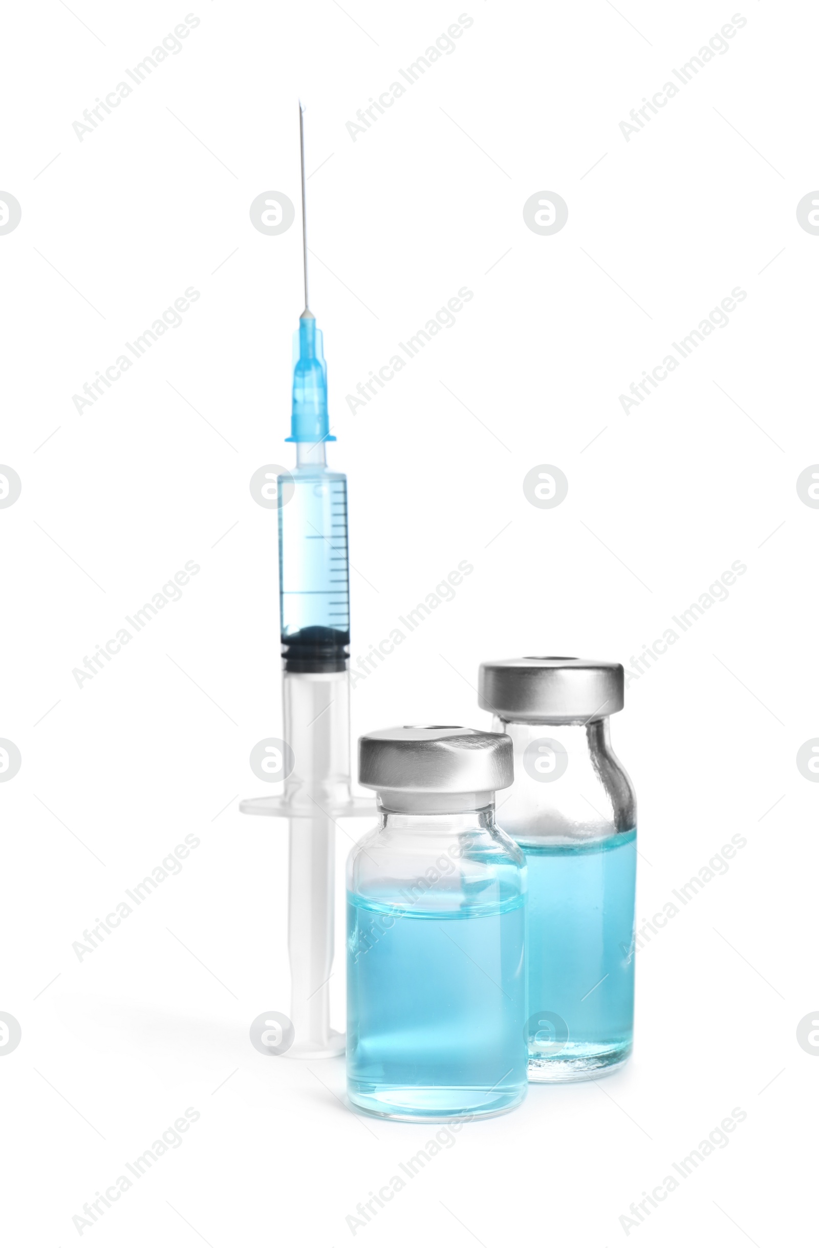 Photo of Vials and syringe on white background. Vaccination and immunization