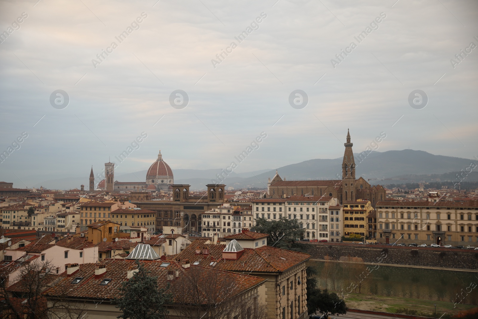 Photo of Florence, Italy - February 8, 2024: Picturesque view of city with beautiful buildings and mointains