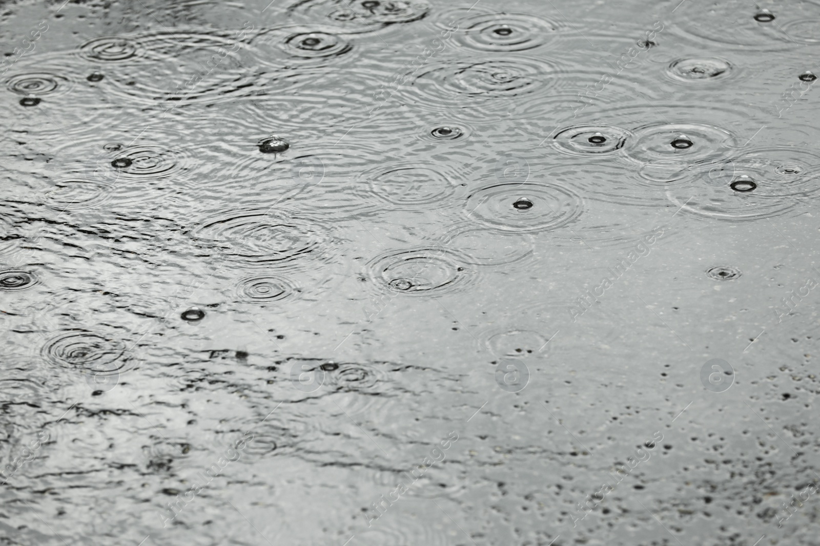 Photo of View of heavy pouring rain on city street