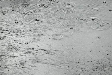 View of heavy pouring rain on city street