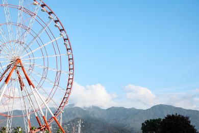 Photo of Beautiful large Ferris wheel outdoors, space for text