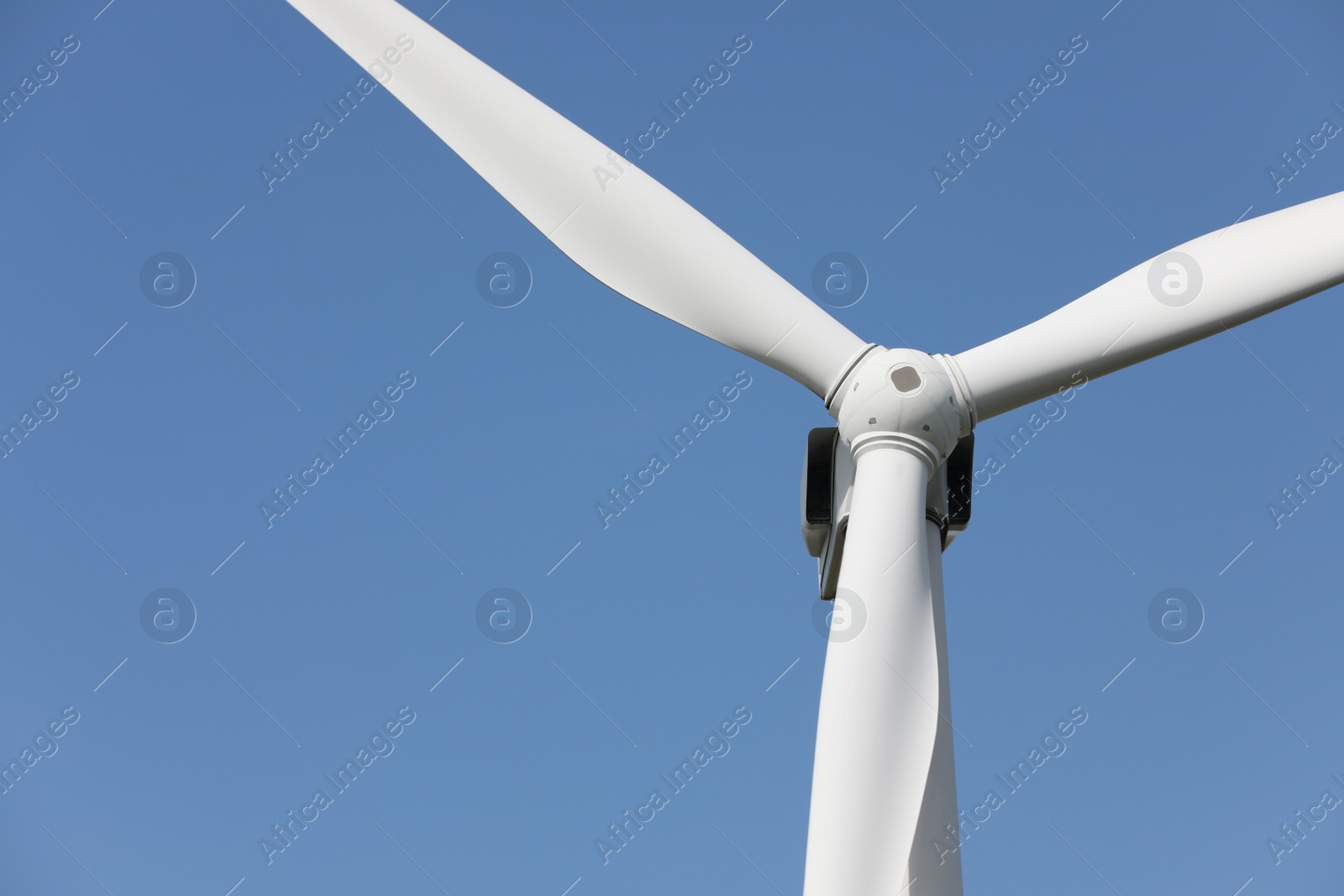 Photo of Wind turbine against beautiful sky, closeup. Alternative energy source