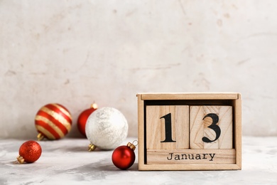 Photo of Wooden block calendar and decor on table. Christmas countdown