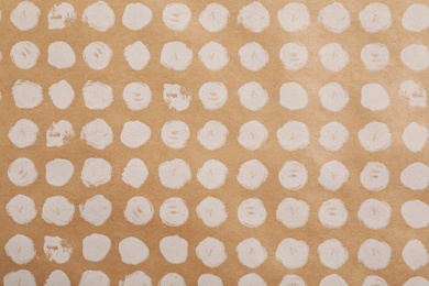 Photo of Color paper sheet with stylish pattern as background, top view