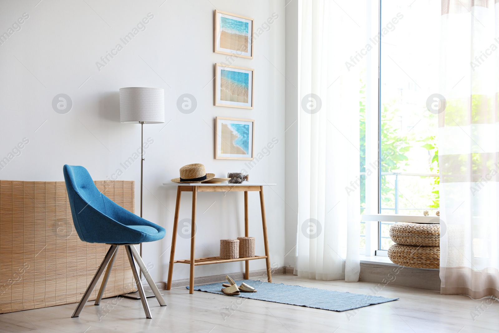 Photo of Stylish room interior with trendy furniture and pictures on wall