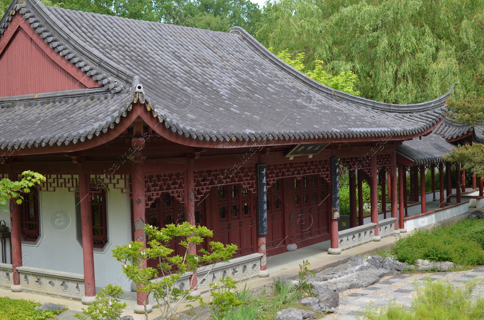 Photo of HAREN, NETHERLANDS - MAY 23, 2022: Beautiful view of oriental building in Chinese garden