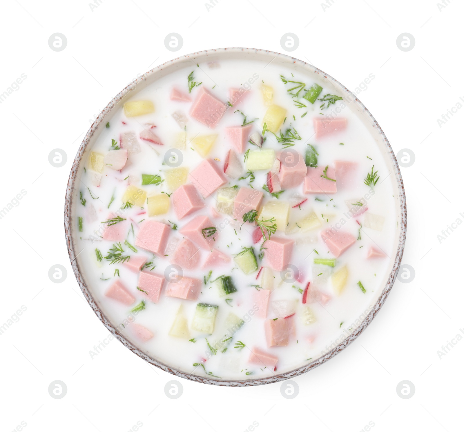 Photo of Delicious cold summer soup (okroshka) with boiled sausage in bowl isolated on white, top view