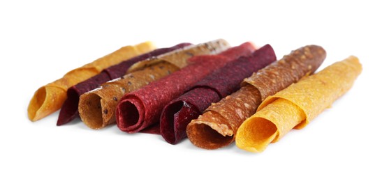 Delicious fruit leather rolls on white background