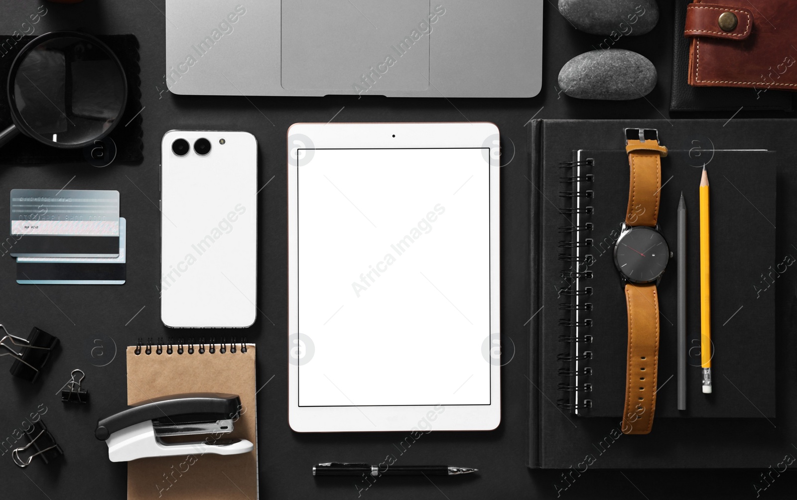 Photo of Flat lay composition with modern tablet on black background. Space for text