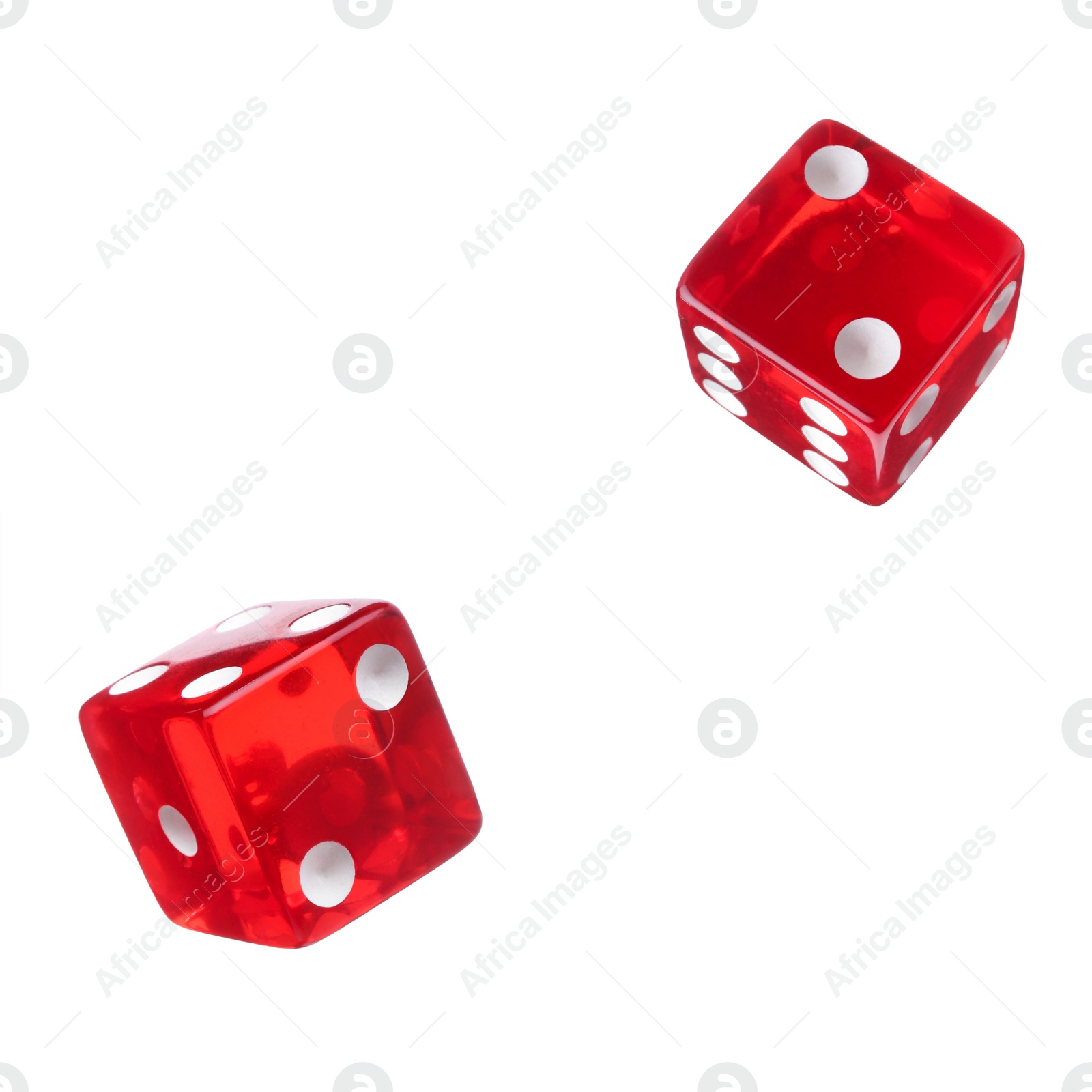 Image of Two red dice in air on white background